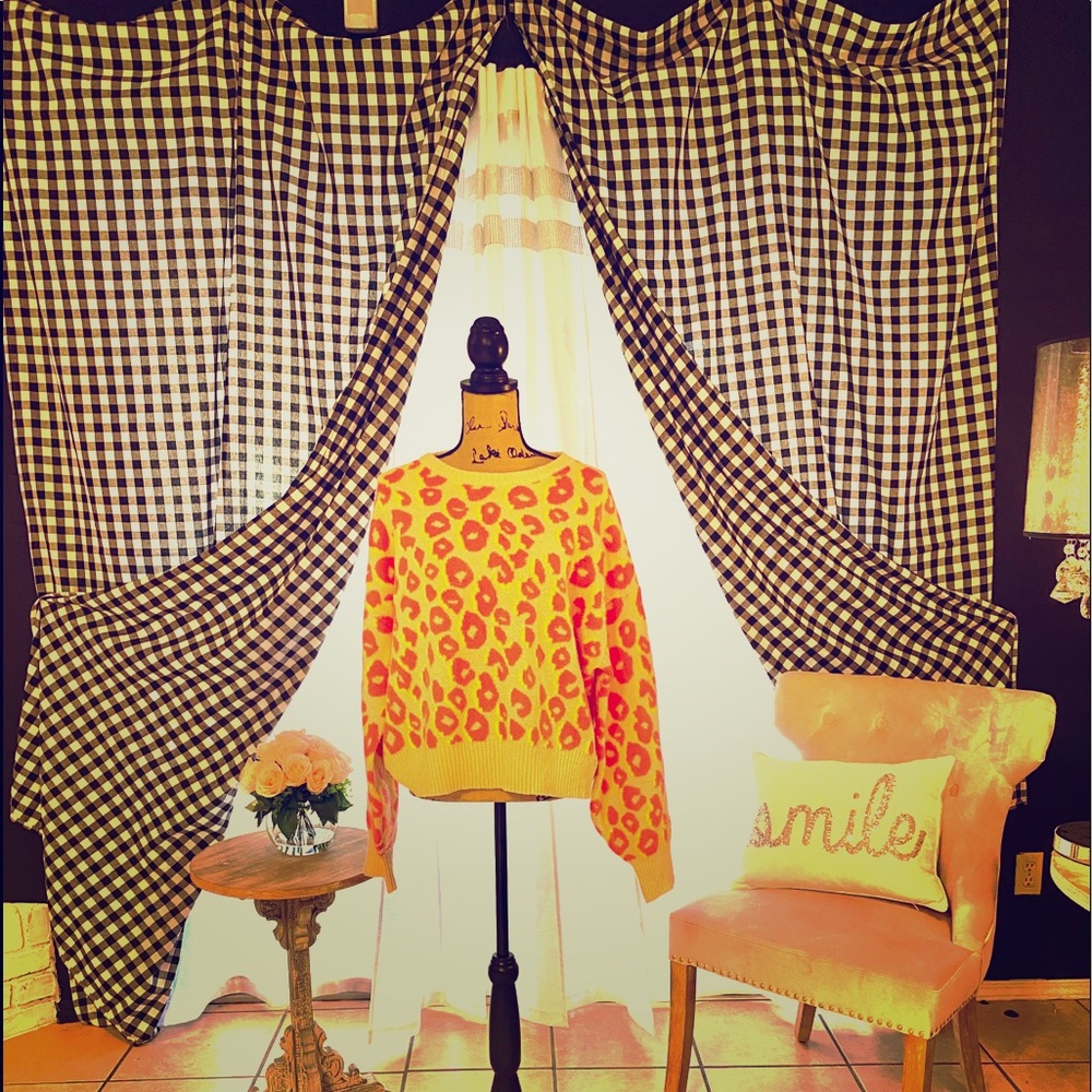 Woman’s leopard neon pink and yellow sweater